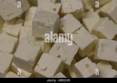 Feta cheese cubes in closeup scene Stock Photo