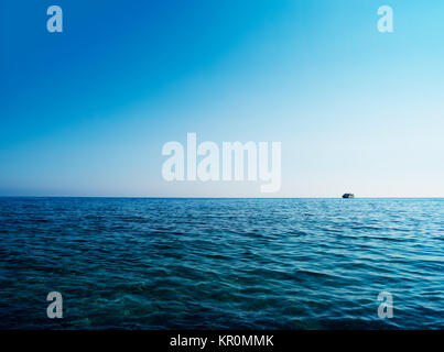 Horizontal blue ocean ship on horizon background Stock Photo
