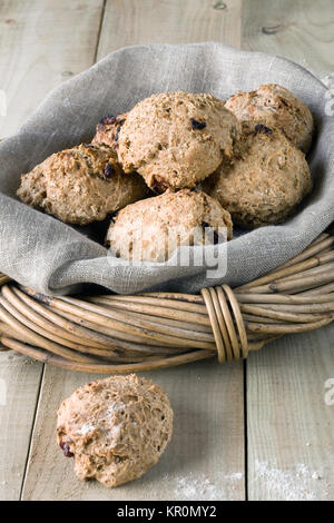 Homemade spelt and cranberry bread rolls in a basket. Stock Photo