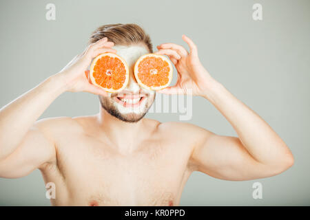 Facial mask from fresh fruits and clay for man concept Stock Photo