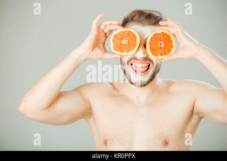 Facial mask from fresh fruits and clay for man concept Stock Photo