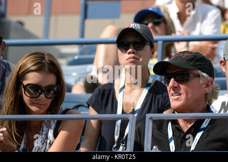 FLUSHING NY- SEPTEMBER 02:  Pro golfer Greg Norman and his wife Kirsten Kutner, Day nine of the 2014 US Open at the USTA Billie Jean King National Tennis Center on September 2, 2014 in the Flushing neighborhood of the Queens borough of New York City   People:  Greg Norman, Kirsten Kutner Stock Photo
