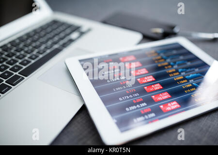 Analyzing stock market from digital tablet Stock Photo