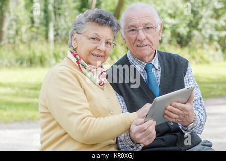 elderly couple with tablet Stock Photo