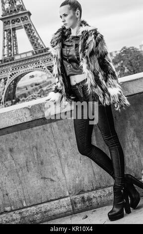 Bold winter in Paris. modern fashion-monger in fur coat in Paris, France looking into the distance Stock Photo