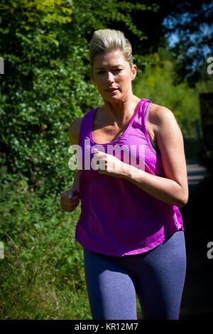 Mature Woman Running Stock Photo