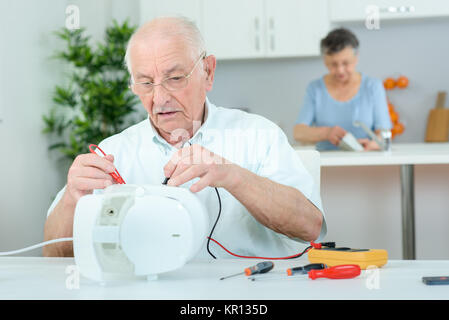 fixing the coffee machine Stock Photo