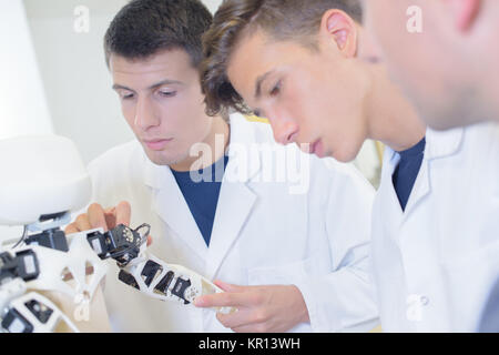 Students working on robot Stock Photo