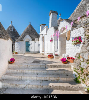 Scenic sight in Alberobello, the famous Trulli village in Apulia, southern Italy. Stock Photo