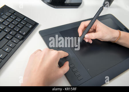 a woman working on his graphics tablet, close up of hands Stock Photo