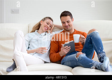 Couple Using Digital Tablet Stock Photo