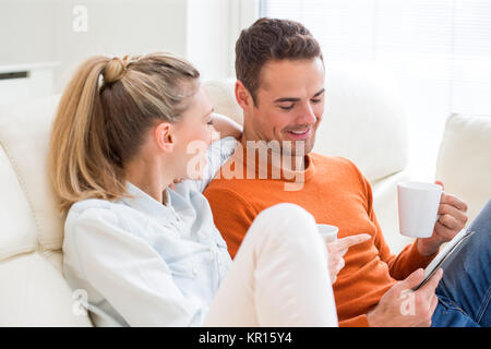 Couple Using Digital Tablet Stock Photo