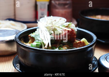 Korean cuisine: Korean Pork bone soup (Gamjatang). Gamjatang or pork back-bone stew is a spicy Korean soup made from the spine or neck bones of a pig. Stock Photo