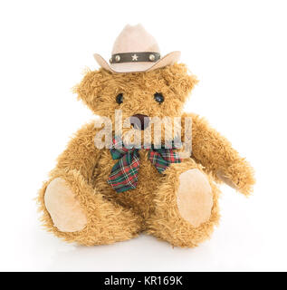 Cowboy teddy bear sitting on white Stock Photo