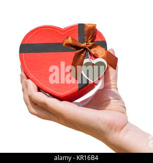 Hand holding a heart shaped box on white Stock Photo