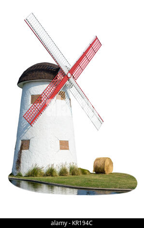 Windmill and straw in the lawn Stock Photo