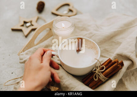 Woman's hand holding cup of coffee Stock Photo