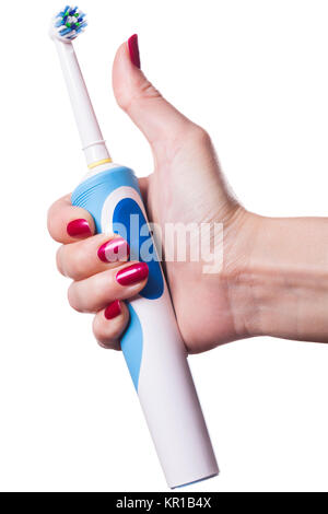 Hand mit elektrischer Zahnbürste und roten Fingernägeln isoliert auf weiß Stock Photo