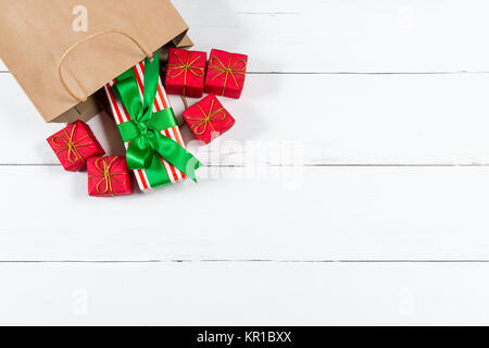 Paper Bag with Christmas Presents Rolling Out Stock Photo