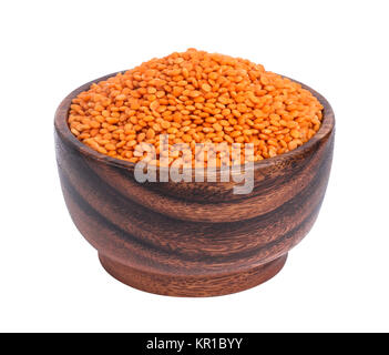 Red lentils in wooden bowl isolated on white background Stock Photo