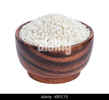 Risotto rice in wooden bowl isolated on white background Stock Photo