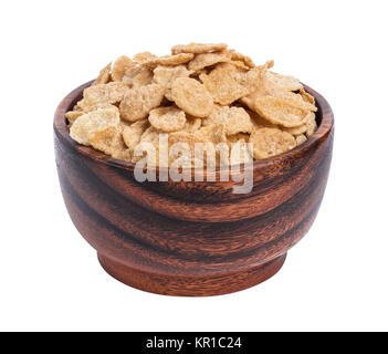 Corn flakes in wooden bowl isolated on white background Stock Photo