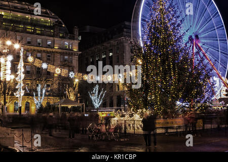 Christmas lights, Christmas tree and fairground attractions in George Square, Glasgow, UK Stock Photo