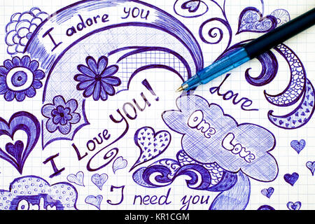 Hand drawn love doodles messages on checkered paper with ballpoint pen. Stock Photo