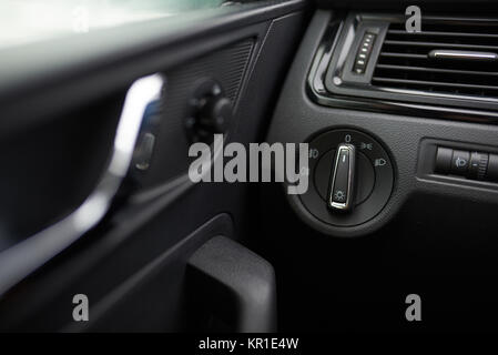 Light switch in car dashboard close up. Repairing electronic in car theme Stock Photo