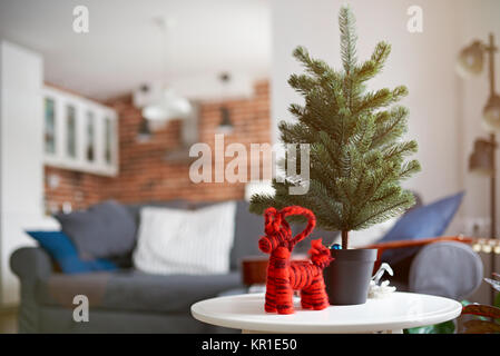 Red christmas toy with pine tree on modern apartments interior Stock Photo
