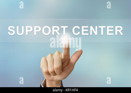 business hand clicking support center button on blurred background Stock Photo