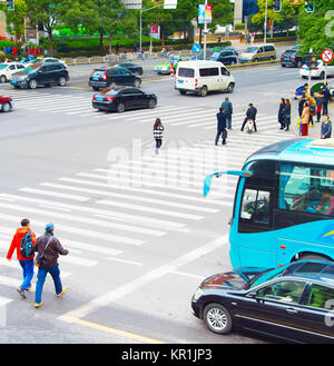 SHANGHAI, CHINA - DEC 28, 2016: People crossing the crosswalk at Shanghai Downtown Stock Photo