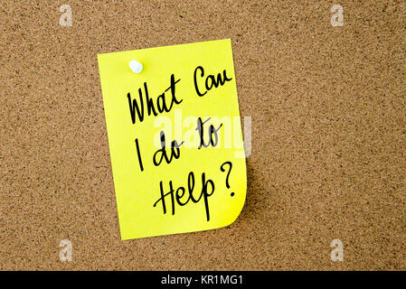 What Can I Do To Help ? written on yellow paper note Stock Photo