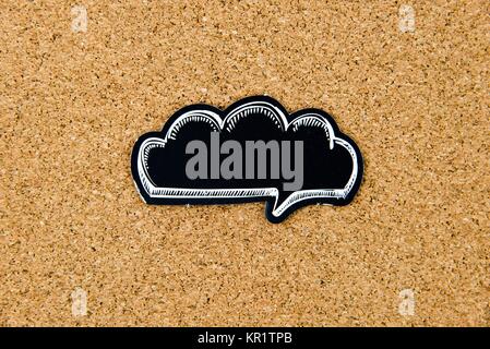 Empty black speech bubble over cork board background Stock Photo