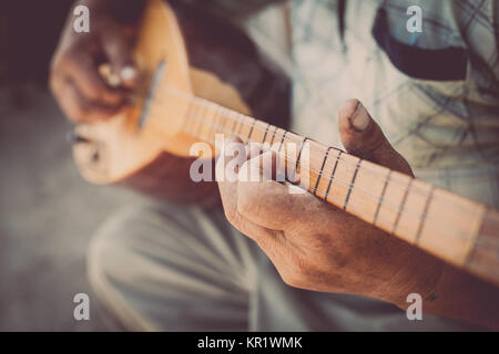 Man playing Tatar instrument Stock Photo