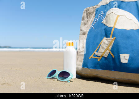 beach bag, cream to tan and sunglasses Stock Photo