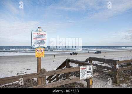 Warning signs posted at the entrance to New Smyrna Beach Florida USA Stock Photo