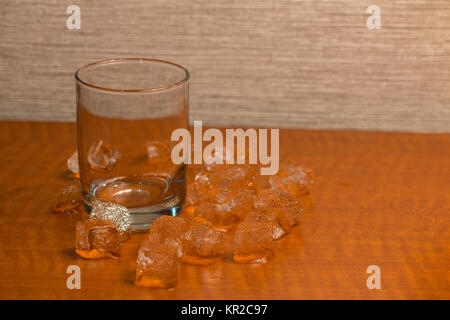 Ice Cubes Around an Empty Glass Stock Photo