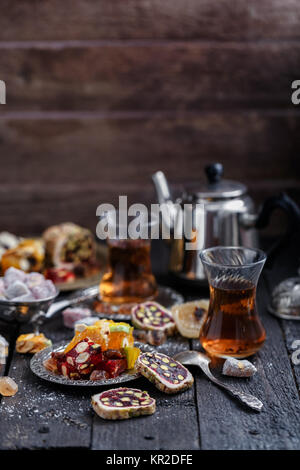 Turkish delight on a dark wood background. Stock Photo