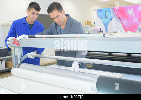 Two men in inductrial printing shop Stock Photo