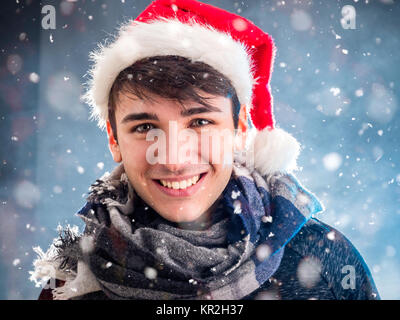 Cheerful man in Santa Claus hat Stock Photo