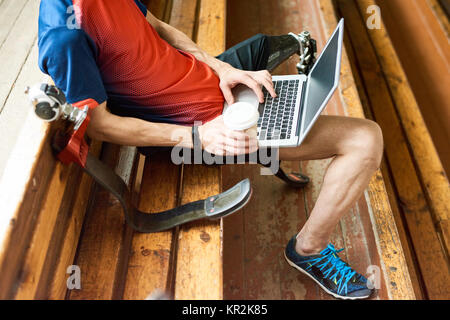 Handicapped Man Using Laptop Stock Photo