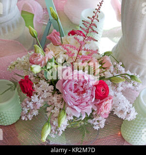 Photo of a spring pink and white bridal bouquet with hydrangea, peonies, ranunculus, roses, astilbe, stock, hyacinths and lisianthus. So sweet! Stock Photo