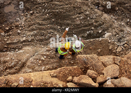Construction Workers Inspecting Site Stock Photo