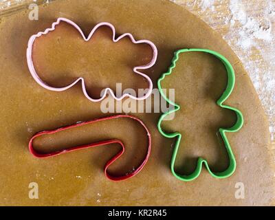 plastic cookie cutters on dough Stock Photo