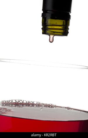 red wine being poured in glass Stock Photo