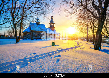 Russian church in winter forest Stock Photo