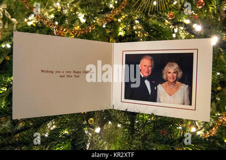The Prince of Wales and Duchess of Cornwall's 2017 Christmas card on a Christmas tree in Clarence House, London. The picture on the card was taken by Hugo Burnand showing the royal couple in the Orchard Room during the private 70th birthday party of The Duchess of Cornwall at Highgrove on Saturday 15th July 2017. Stock Photo