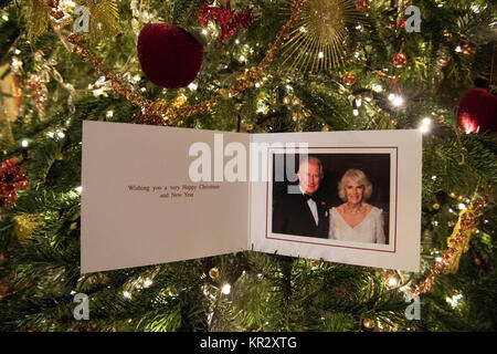 The Prince of Wales and Duchess of Cornwall's 2017 Christmas card on a Christmas tree in Clarence House, London. The picture on the card was taken by Hugo Burnand showing the royal couple in the Orchard Room during the private 70th birthday party of The Duchess of Cornwall at Highgrove on Saturday 15th July 2017. Stock Photo