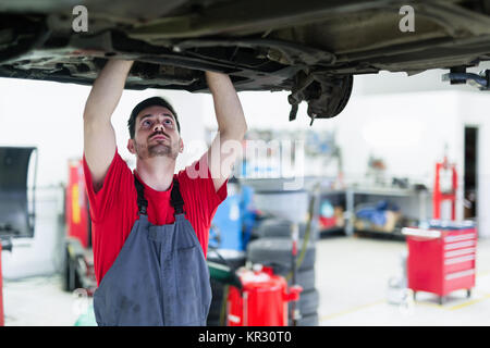 Car mechanic working at automotive service centera Stock Photo